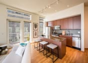 Thumbnail 7 of 20 - a kitchen and living room in an apartment