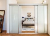 Thumbnail 12 of 20 - a bedroom with a bed and a window