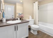 Thumbnail 17 of 26 - a bathroom with a sink toilet and a bath tub
