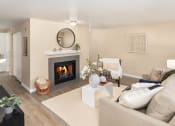 Thumbnail 4 of 26 - a living room with a fireplace and a couch