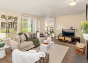 Thumbnail 1 of 26 - a living room with a couch and a tv