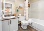 Thumbnail 16 of 26 - a bathroom with a sink toilet and bath tub