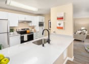 Thumbnail 8 of 26 - a kitchen with a large counter top and a sink