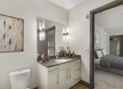 Thumbnail 11 of 22 - a bathroom with a toilet sink and mirror