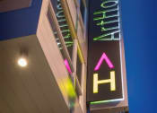 Thumbnail 22 of 22 - a neon sign outside of a building