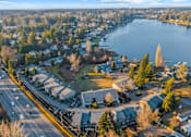 Thumbnail 31 of 41 - A small town with a large lake in the background.