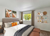 Thumbnail 3 of 29 - A bedroom with a large bed and a window with a view of trees.