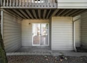 Thumbnail 26 of 29 - A small white house with a door and a window.