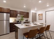 Thumbnail 5 of 18 - a kitchen with a large island with four chairs and a stainless steel refrigerator