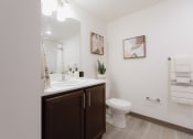 Thumbnail 24 of 24 - a bathroom with a sink and a toilet and a mirror