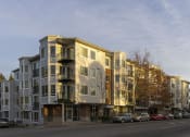 Thumbnail 20 of 20 - a rendering of an apartment building on a city street