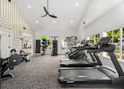 Thumbnail 8 of 38 - A gym with treadmills and exercise equipment.