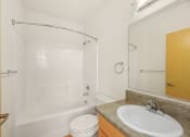 Thumbnail 32 of 42 - a bathroom with a sink toilet and a tub