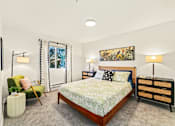 Thumbnail 31 of 34 - a bedroom with a bed and a chair