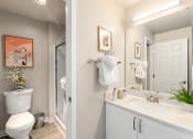 Thumbnail 8 of 20 - a bathroom with a toilet sink and mirror