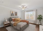 Thumbnail 15 of 31 - a bedroom with a bed and a ceiling fan