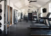 Thumbnail 12 of 48 - a gym with treadmills and other exercise equipment