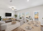 Thumbnail 11 of 31 - a living room with a couch and a table