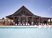 Thumbnail 14 of 48 - a house with a pool and lounge chairs
