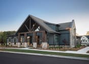 Thumbnail 1 of 48 - a view of the front of a house with stone and wood