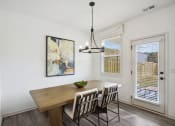 Thumbnail 30 of 48 - the dining room of a home with a wooden table and chairs