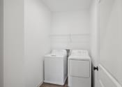 Thumbnail 32 of 48 - a laundry room with two washes and a dryer