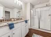 Thumbnail 19 of 31 - a bathroom with a sink and a shower