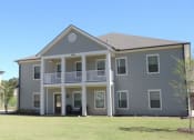Thumbnail 4 of 16 - a gray house with a yard in front of it