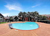 Thumbnail 25 of 26 - A small pool surrounded by a brick patio.