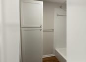 Thumbnail 34 of 35 - a white refrigerator freezer sitting next to a bath tub