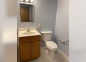 Thumbnail 10 of 22 - an empty bathroom with a toilet and a sink
