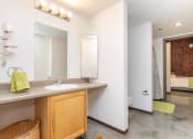 Thumbnail 5 of 34 - a bathroom with a sink and a mirror and a toilet