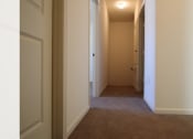 Thumbnail 11 of 16 - the hallway leading to the bedrooms and the closet