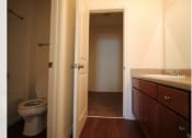 Thumbnail 8 of 16 - a bathroom with a toilet and a sink