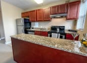 Thumbnail 30 of 43 - Kitchen area at Convent Gardens Apartments, St. Louis, MO