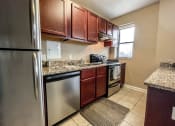 Thumbnail 29 of 43 - Kitchen with cabinets at Convent Gardens Apartments, Missouri, 63108