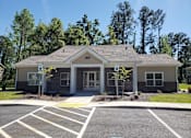 Thumbnail 1 of 11 - A small building with the number 185 on it.