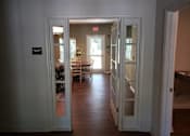 Thumbnail 6 of 11 - A hallway with a sign that says "EXIT ONLY" on the wall.