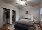 Thumbnail 13 of 23 - A bedroom with a bed, a dresser, and a ceiling fan.