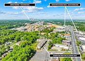 Thumbnail 8 of 8 - An aerial view of a city with a senior high school and two directional arrows indicating the distance to uptown Charlotte and restaurants and grocery stores.