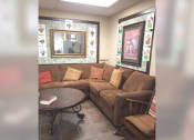 Thumbnail 7 of 15 - a living room with a couch and a table