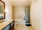 Thumbnail 35 of 39 - a bathroom with a shower toilet and sink at Metro67, Memphis, TN, 38103