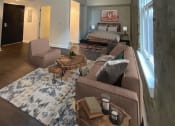 Thumbnail 4 of 9 - a living room with couches and a bed in a room with a large window at Union Alley, Memphis, TN, 38103