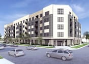 Thumbnail 4 of 4 - A modern apartment building with cars parked in front.