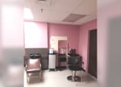 Thumbnail 12 of 15 - a patient room with a chair and a desk in it