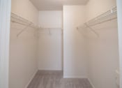 Thumbnail 16 of 33 - an empty closet in a room with white walls