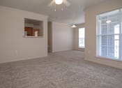Thumbnail 21 of 33 - an empty living room with a large window