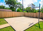 Thumbnail 30 of 33 - a basketball court in the backyard of a house