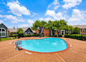 Thumbnail 22 of 27 - A small pool surrounded by a brick patio.