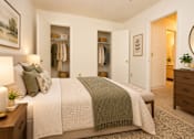 Thumbnail 30 of 50 - A bedroom with a large bed and a wardrobe.